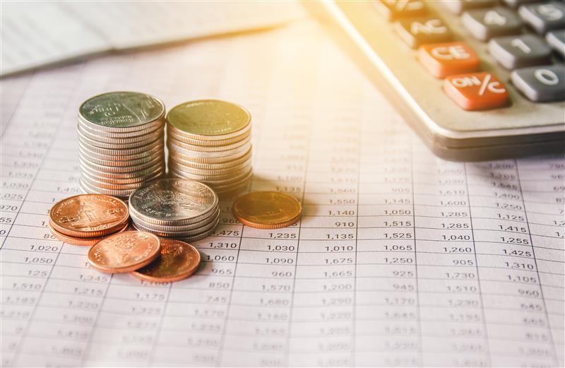 Currency on top of a chart with a calculator
